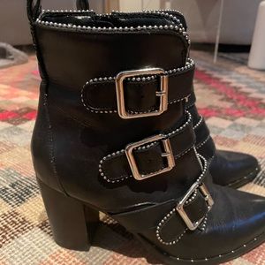 Black Steve Madden booties with silver zipper detail